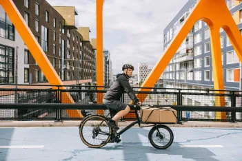 Cargo bike courier riding through the city