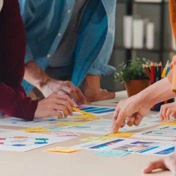 People brainstorming ideas with post-its.
