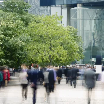 Commuters walking in a financial district.