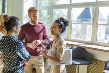 Diverse business group discussing with each other.