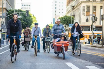 Community members riding together on car-free street