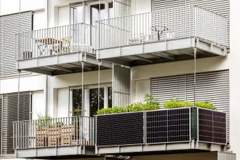 Solar panels on balcony of apartment building. 