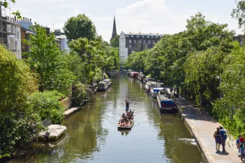 People enjoy a warm day on Regent's Canal in Primrose Hill, Camden
