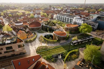 Aerial drone view of Odense city on a sunny day.