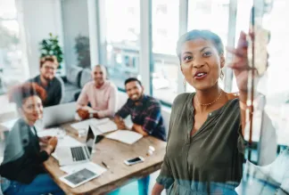 Shot of a group of young businesspeople having a brainstorming session in a modern office.