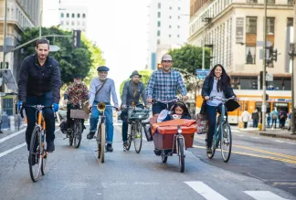 Community members riding together on car-free street