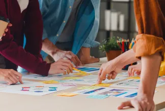 People brainstorming ideas with post-its.