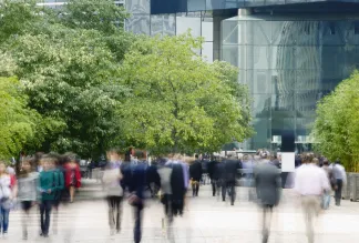 Commuters walking in a financial district.