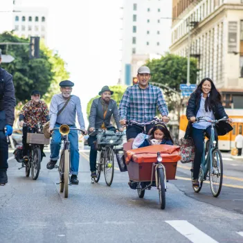 Community members riding together on car-free street