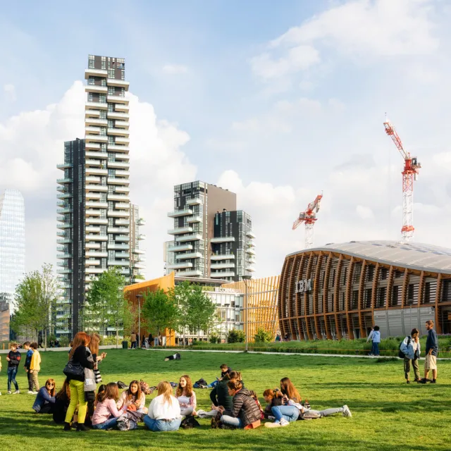 People relax in Biblioteca degli alberi park in Gae Aulenti square.